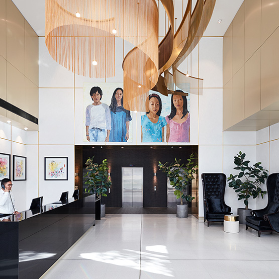 An artistic, open plan hotel lobby with art on the walls